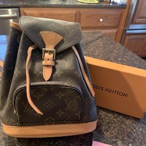AUTHENTIC and discontinued Louis Vuitton  montasouris pm backpack.